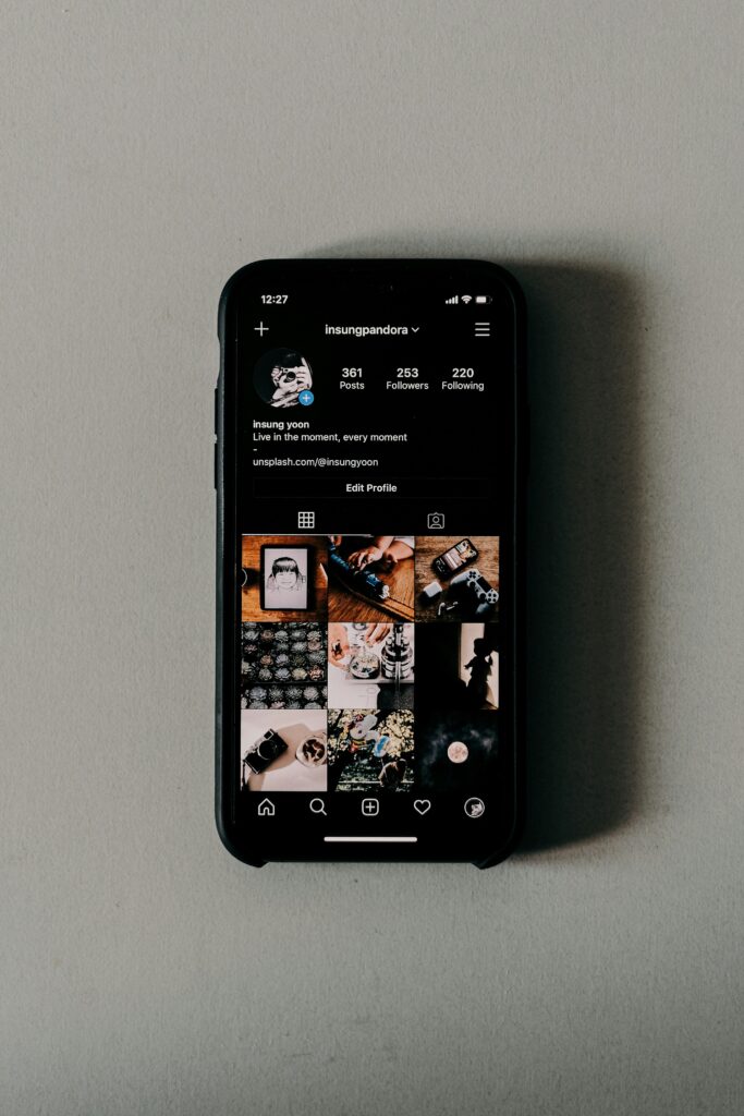 A phone displaying a teenager's Instagram account